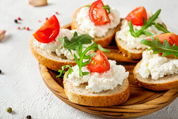 Healthy and tasty snack with bread, tomatoes and cottage cheese