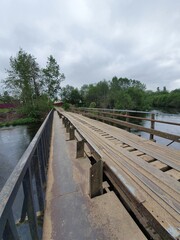 Naklejka na ściany i meble wooden bridge over river