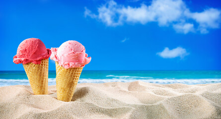Ice creams cones and seashells in the sand on the beach