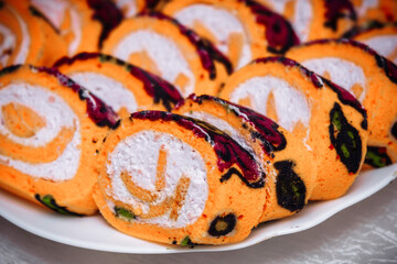 Orange roll. The roll is cut into slices for the holiday.