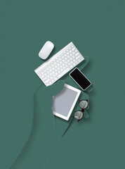 Human hand made of paper holding accessories and belongings for working, talking online, shopping on green background. Contemporary colorful and conceptual bright art collage, mockup with copyspace.