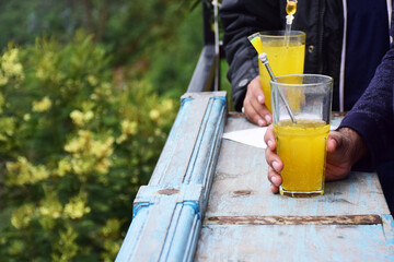 glass of orange juice on wooden table