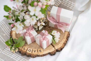 Vase with flowers. Gift boxes wiyh powdery ribbon.  Silver bracelet with charms is best gift box for the New Year and Christmas. Best gift for Valentines Day and Mothers day, birthday. 