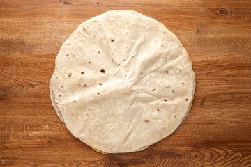 Pita bread on wooden background. Pita bread. National cuisine.