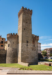 umbertide, italy,defense towers a medieval city in central Italy, front view with blue sky background and old houses, natural light