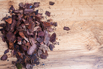 Dry pine bark for transplanting orchids of other plants. The substrate for orchids. Soil for mulching. Orchid transplant at home. Preparing for a houseplant transplant.