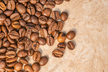  coffee beans on white and yellow marble top view