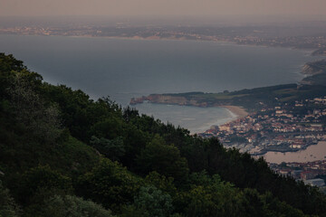 Obraz premium View from Txingudi bay with the mouth of Bidasoa river between Irun, Hondarribia and Hendaia at the Basque Country. 