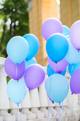 
Blue and purple balls in bundles to create a festive atmosphere on a sunny day.