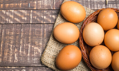 Frsh eggs on wood vintage background.