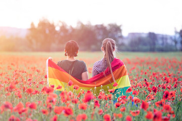 Young woman with LGBT flag.