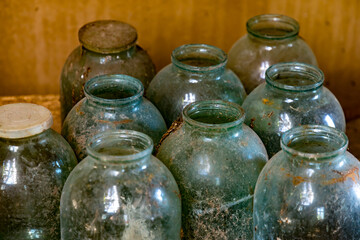 old glass jars in a row