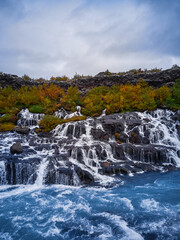 Incredibly beautiful Hraunfossar Waterfall. Lava waterfalls. waterfall flowing down from the lava fields on the canyon of the hvita river, Iceland. Iceland's clean water