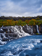 Incredibly beautiful Hraunfossar Waterfall. Lava waterfalls. waterfall flowing down from the lava fields on the canyon of the hvita river, Iceland. Iceland's clean water