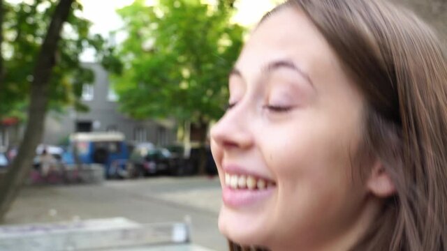 Following a pretty teenage girl walking