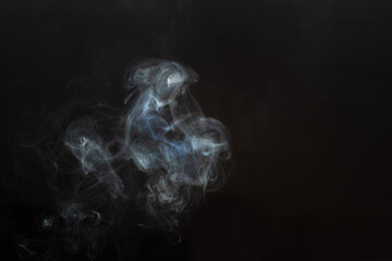 White smoke isolated on a black background. smoke image is like a ghost