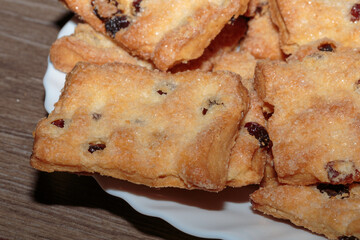 Tasty sugar cookies with raisins closeup.