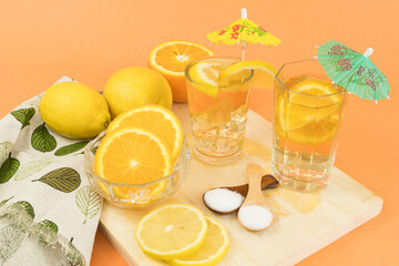 Glasses of cold tea with slices of orange and lemon