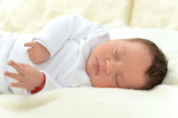 Fototapeta na wymiar Cute little baby boy on bed sleeping