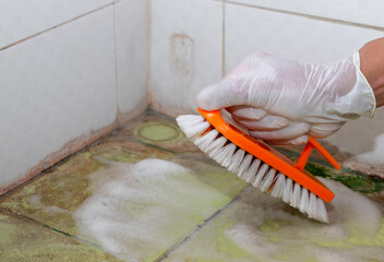 Copy space of hand people is scrubbing brush on surface of the floor is spread of disease and bacteria.