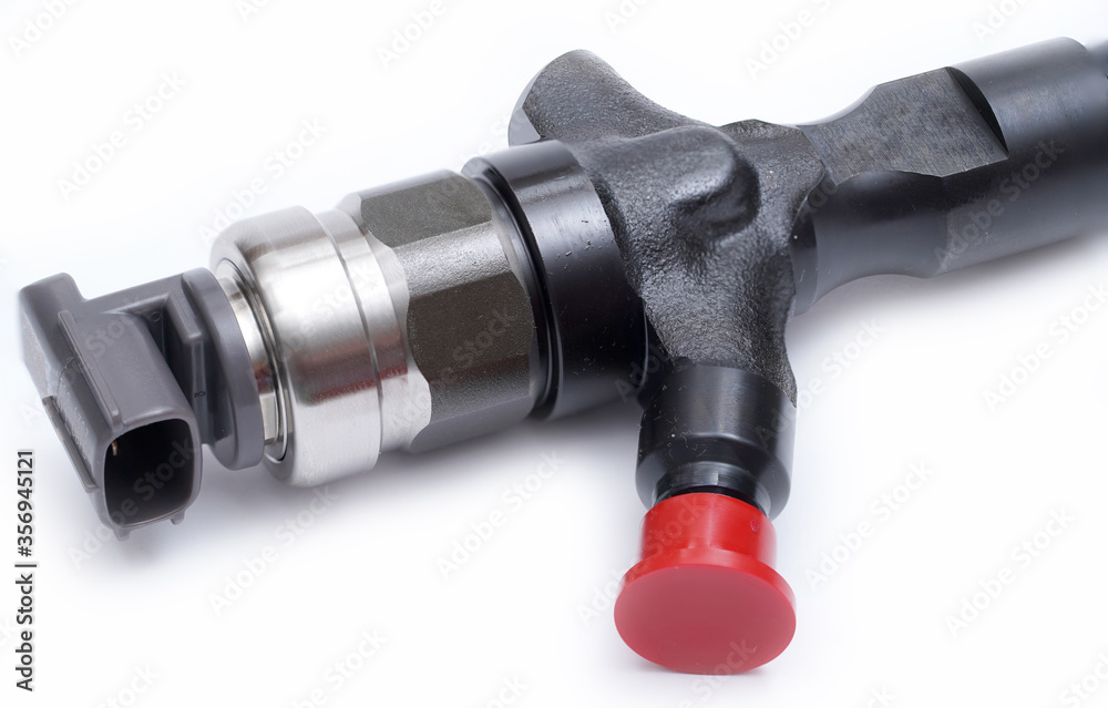 Wall mural Car fuel injector isolated on white background. Close up. Selective focus