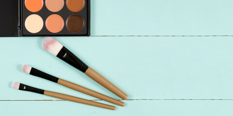 Makeup palette with makeup brush makeup background