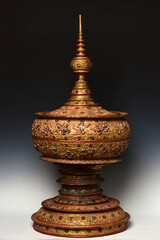 Fototapeta na wymiar Vintage Large Burmese lacquered vessel with gilded gold and glass
