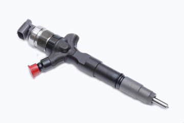 New injector for the diesel engine on a white background. Spare parts for the car. Special toning