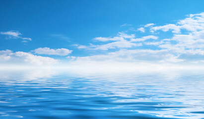 Obraz na płótnie Canvas Summer seascape. Blue sea and sky with fluffy clouds. Bright sunny day, tropical beach.