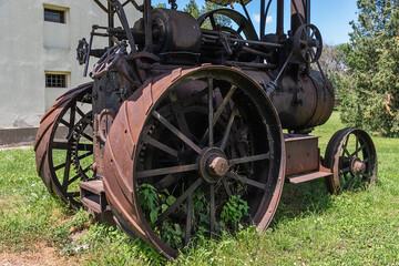 Fototapeta na wymiar Kulpin, Serbia - June 02, 2020: Vintage 1924 Old tractor (Hofherr Schrantz Clayton Shuttleworth) on display at the Serbia. 