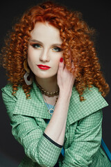 Fototapeta premium girl with red hair and white skin, curly curly hair, lush hairstyle, red lipstick, beautiful makeup,