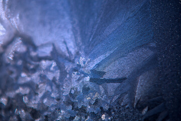 frost pattern on glass, blue abstraction, frost on the surface, beautiful natural texture,