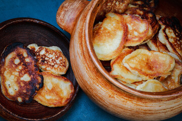 delicious pancakes in a clay pot
