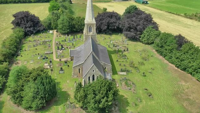 Aerial view of a brilliant rural church in the summer sunshine