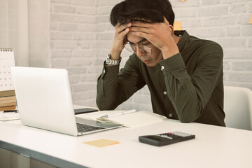 man freelancer feeling tired frustrated stressed from hard work. exhausted businessman have headache