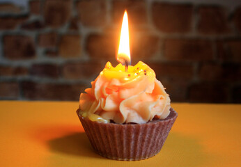 Cake shaped candle on the table, candlelight