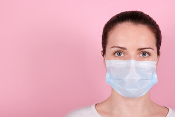 Portrait of a brunette girl in a medical mask.
