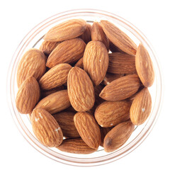 Almonds in glass bowl isolated on white background flat lay closeup view