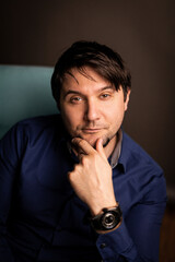 business man portrait against a dark background