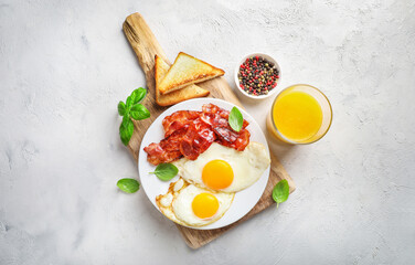 Traditional american breakfast with bacon and eggs