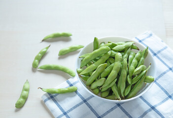Edamame in white bowl with copy space. Japanese food