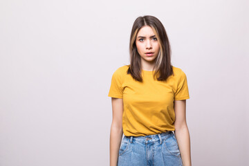 Fototapeta premium Young casual woman isolated over white background.