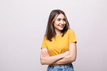Young casual woman isolated over white background.