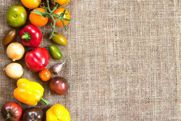 Assortment of fresh vegetables on sackcloth background
