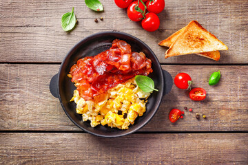 Traditional american breakfast with bacon and eggs