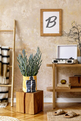 Neutral composition of sitting room interior with brown mock up photo frame, design wooden console, plants in hipster pot, decoration, book, grunge wall and personal accessories.