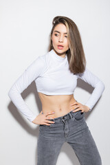 Smiling female fashion model isolated on white background