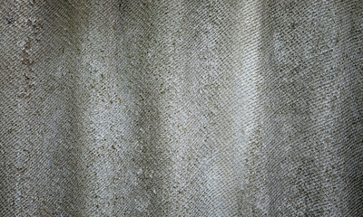 gray sheet of slate, abstract texture background. Wavy old asbestos slate surface