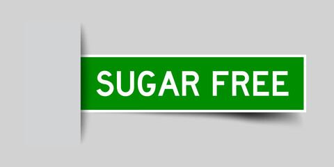 Inserted green color sticker label with word sugar free on gray background