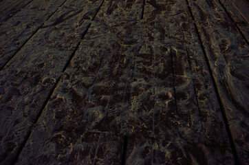 foot prints in snow on wooden pier at night